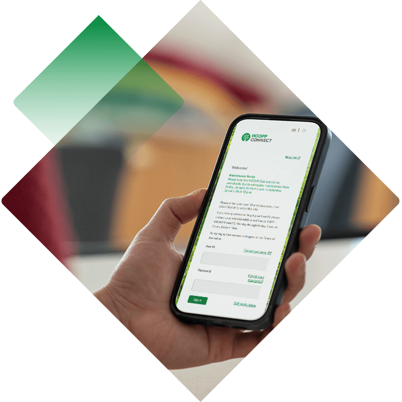 A hand holding a smartphone displaying the HOOPP Connect login screen.
